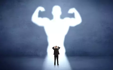 Abstract of businessman flexing his muscles