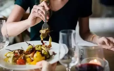 Woman enjoying a salad in a restaurant